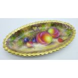A Royal Worcester oval dish, hand decorated with fruit and signed Freeman, with gilt border, 18cm