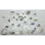 Twenty-five pairs of silver earrings