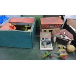 A collection of Britains farmyard figures and buildings