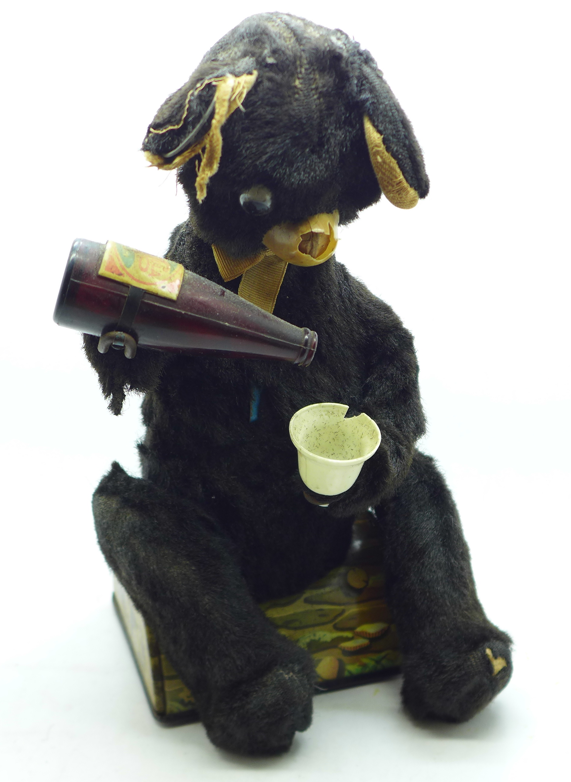 A Japanese battery operated tin-plate automated drinking bear toy, a/f