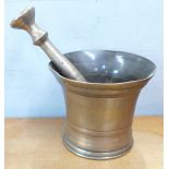 A bronze pestle and mortar