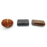 A Bakelite snuff box, one other snuff box and an egg shaped carved pomander