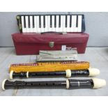 A Hohner melodica, a Hohner Echo mouth organ, two recorders and a penny whistle