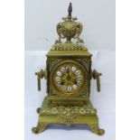 A late 19th Century brass mantel clock, the Japy Freres movement striking on a bell and with