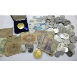Assorted tokens, coins and banknotes
