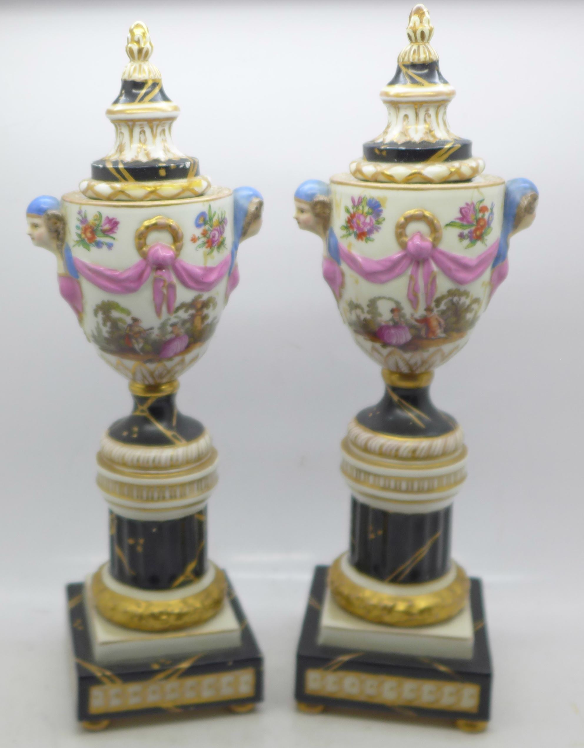 A pair of continental candlesticks, a/f, 28cm