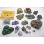 A collection of mineral samples including Fluorspar, crazy lace agate, garnet, dioptase katanga,