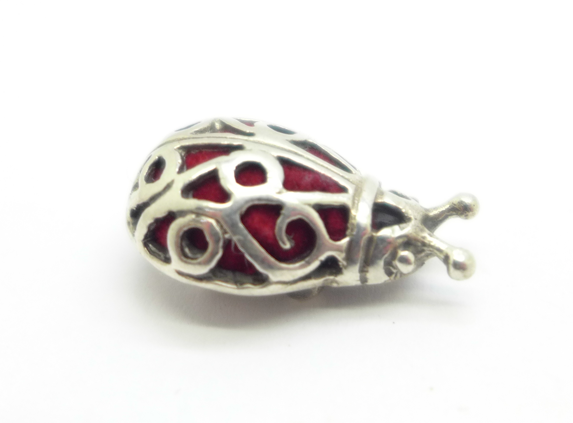 A small novelty sterling silver charm size 'ladybird'