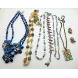 A Butler & Wilson blue bead necklace and five other necklaces and a jewellery set, pendant and chain