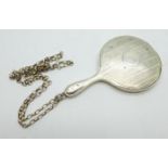 A silver miniature hand mirror on a silver chain