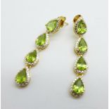A pair of silver gilt and peridot pendant earrings