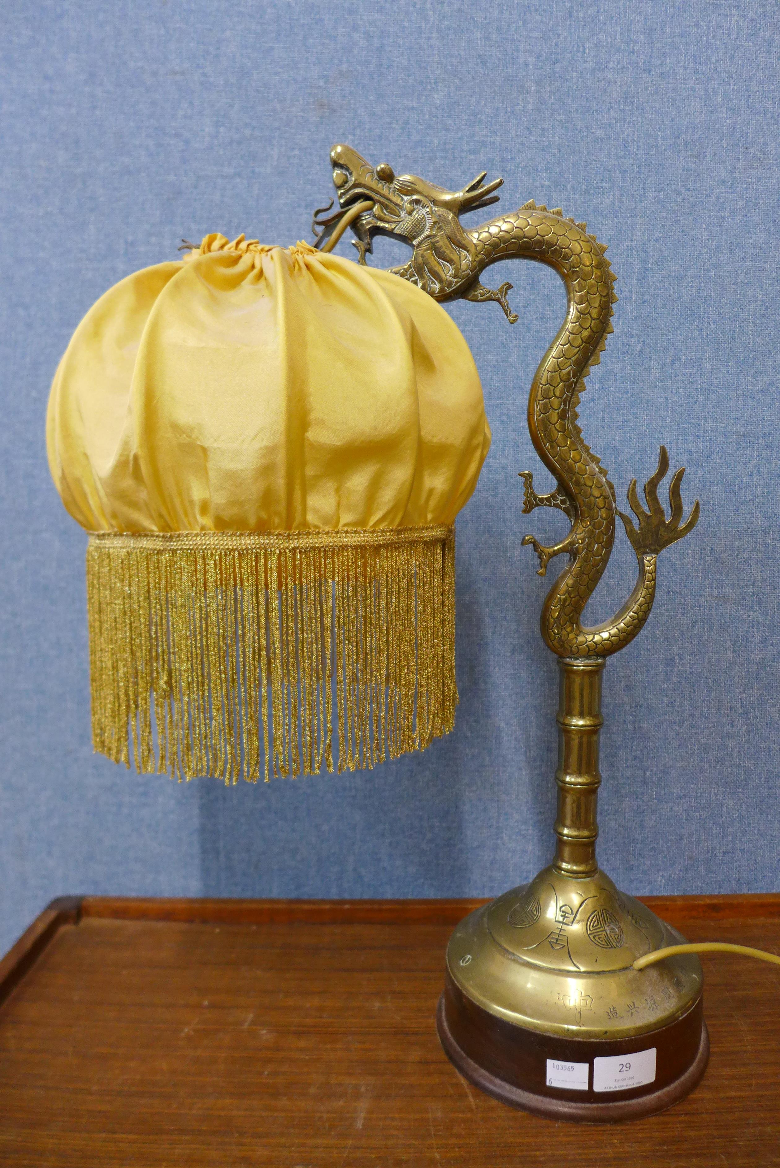 A Chinese brass dragon table lamp