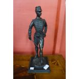 A bronze figure of a French soldier, on black marble socle