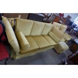 A gold fabric upholstered Knole settee and matching pair of armchairs