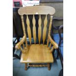 A low beech farmhouse armchair