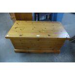 A reproduction pine blanket box