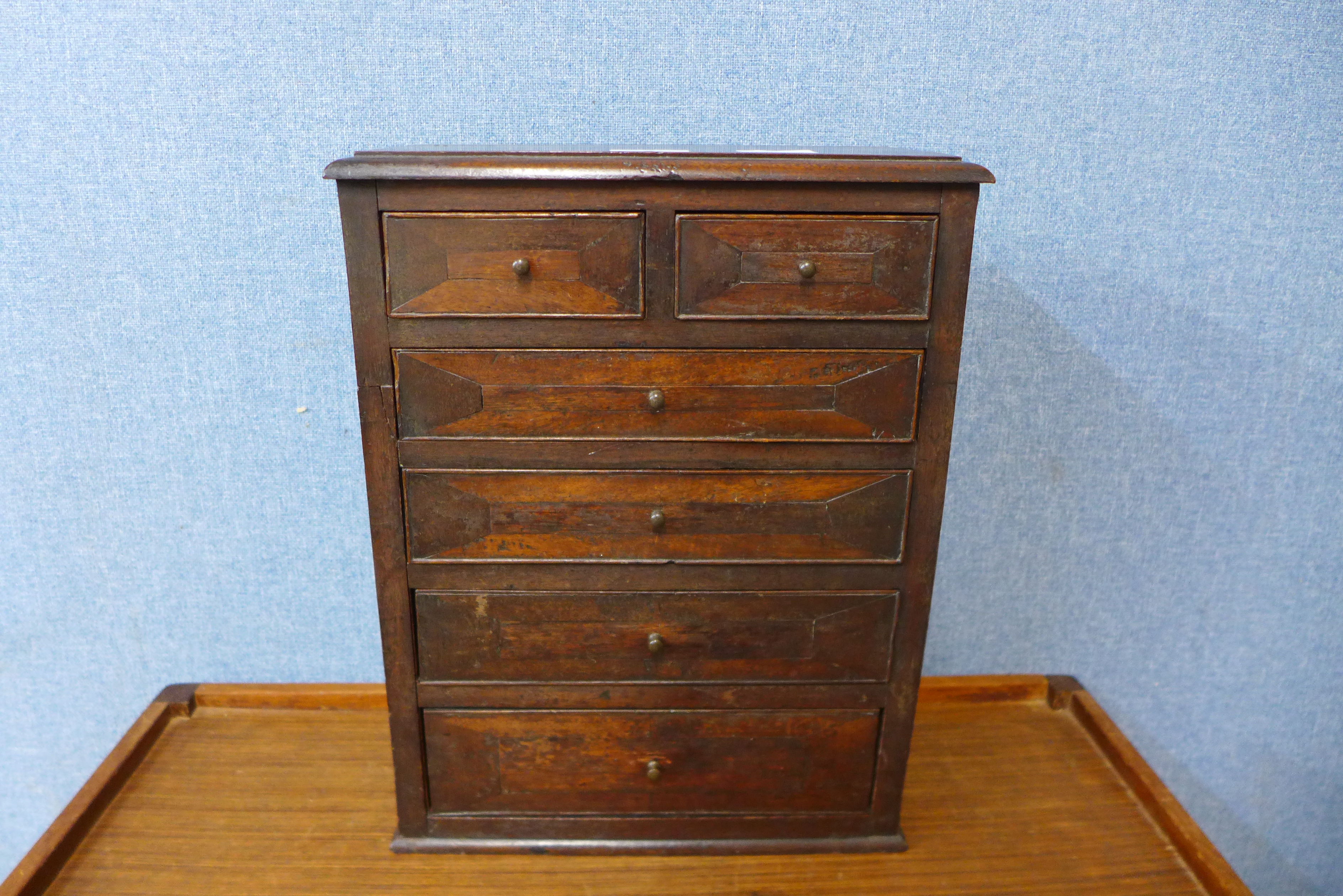 A Victorian pine and mahogany table top chest of drawers, 41cms h x 31cms w