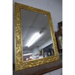 A gilt framed mirror