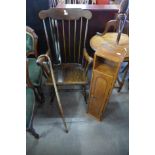 A mahogany rocking chair, a walking stick and small cupboard