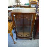 A walnut display cabinet