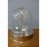 A cut glass dome display cabinet