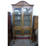 An Edward VII inlaid mahogany display cabinet