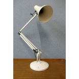 A white metal anglepoise desk lamp