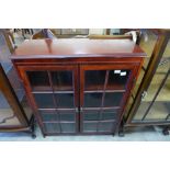 A mahogany two door bookcase