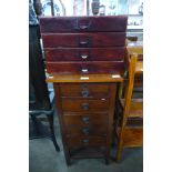 A beech four drawer sewing cabinet and a small mahogany chest of drawers