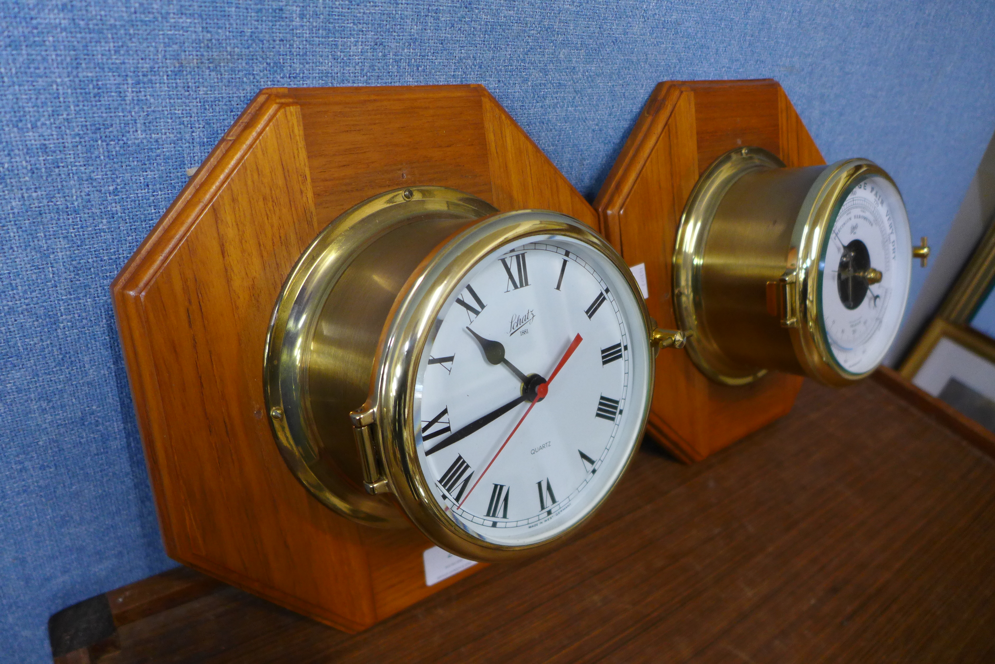A Schatz marine aneroid barometer and matching wall clock, mounted on oak octagonal plinths - Image 2 of 2