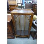 A walnut display cabinet