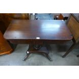 A George IV mahogany fold over tea table