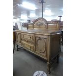 A carved oak buffet sideboard