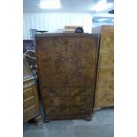 An Art Deco figured walnut tallboy