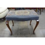 A Queen Anne style walnut cabriole leg stool