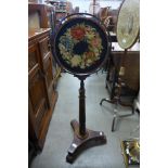 A George IV rosewood and upholstered polescreen