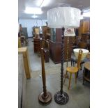 Two George V oak standard lamps