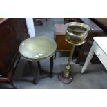 A brass jardinere on stand and a brass topped table