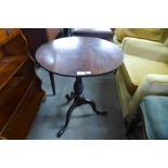 A George III mahogany circular tilt top tripod table