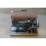 A Singer oak cased sewing machine