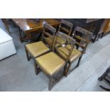 A set of four carved oak dining chairs