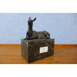 A small bronze figure of a horse, on black marble socle