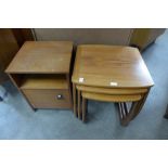 A teak nest of tables and a bedside table