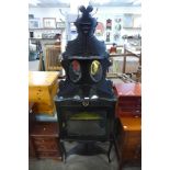 A Victorian ebonised freestanding corner cabinet