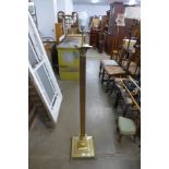 A brass Corinthian column standard lamp