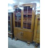 A carved oak four door bookcase