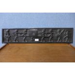 A carved ebony tribal plaque