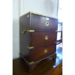 A small campaign style mahogany and brass mounted chest of drawers
