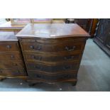 A George III style mahogany serpentine bachelors chest of drawers