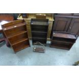 Three small oak open bookcases and a brass and mahogany magazine rack